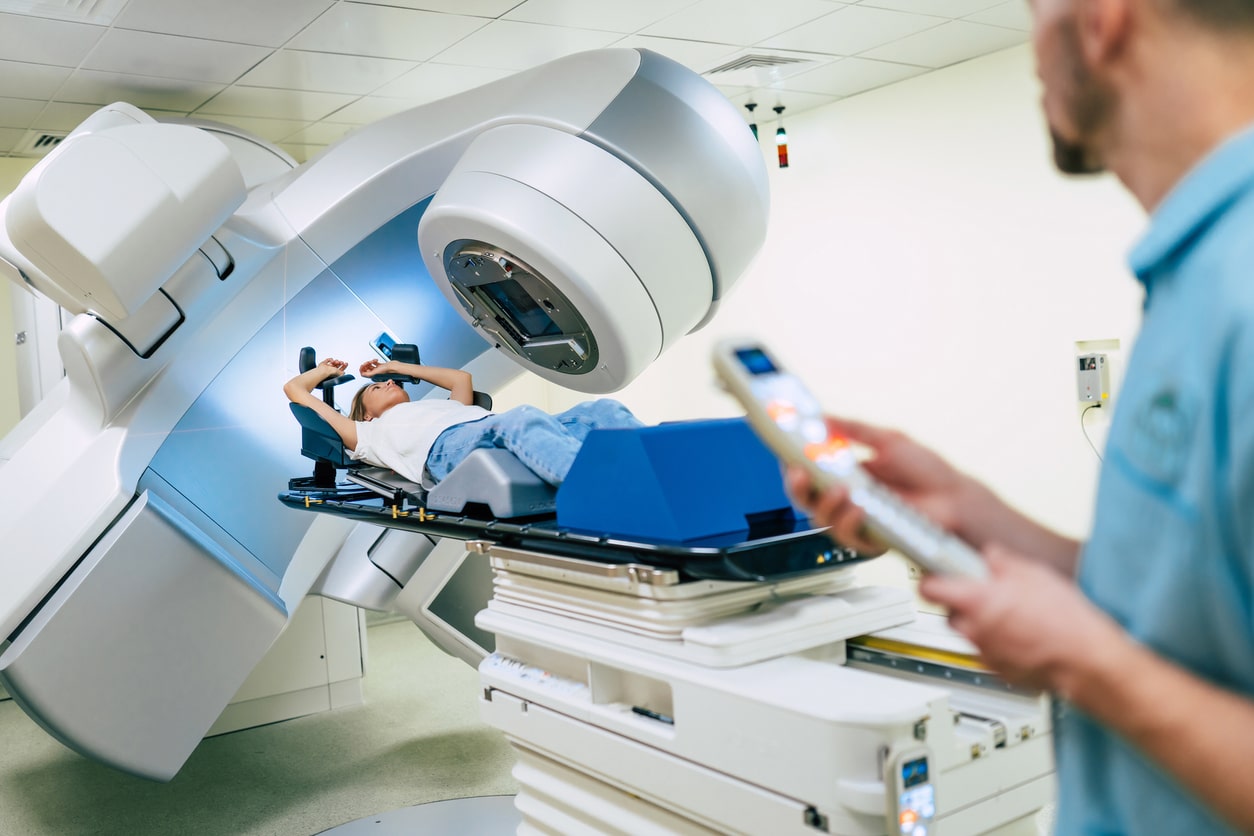 Radiation therapy machine with technician and patient